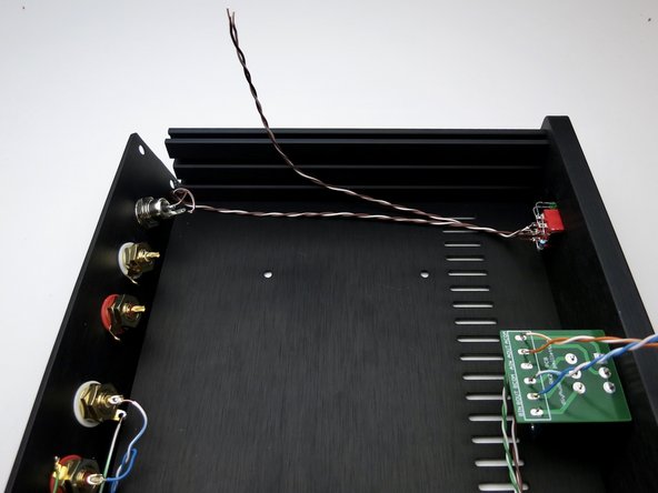Photo 1 - Wires to middle of front panel power switch. Brown is barrel center, white/brn is tab (photo 3).