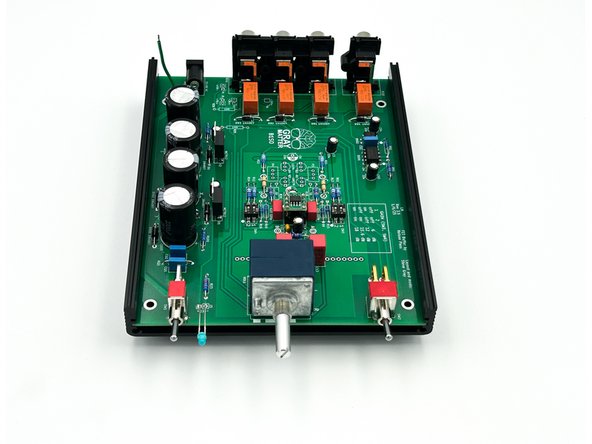 In the bottom chassis half, slide the PCB into the middle slot in the  side rails with the components facing toward the top. See photo 2.