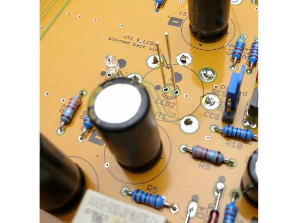 Photo 2 - solder the LED into the board only after the socket is installed.  Make sure the LED is not higher than the socket.  Note that the short leg of the LED is on the side with the black dot.