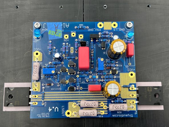 Photo 1 - I place the Keratherm on the heatsinks aligning the holes first as shown.