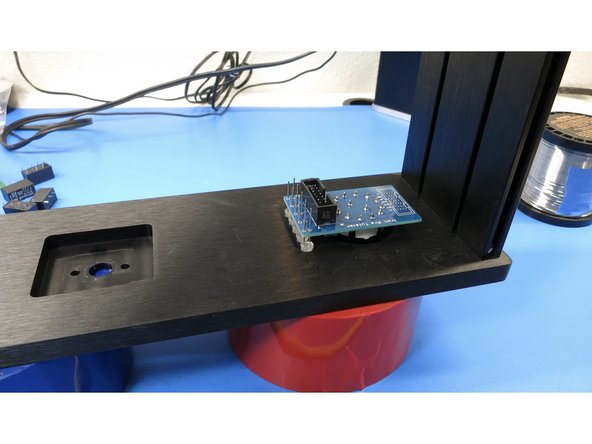 Place the front panel face down on a flat surface.   Do not rest the chassis on the switch shaft; it will break.  Be creative and rest the front panel on a roll of tape or use some other method to keep the weight off of the shaft.  Gently tap the LEDs into their respective holes.