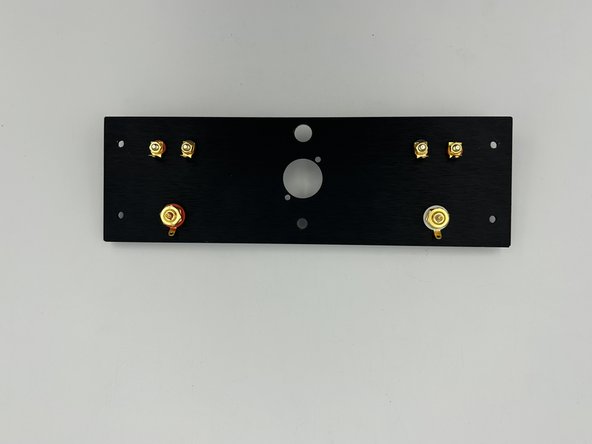 Install the binding posts with the tab pointing toward the middle of the chassis.
