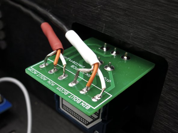 Take note that each channel's wiring has a color-coded heatshrink.  In this case, white is for left, red is for right.