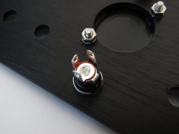 The tab that connects to the center (the bottom tab, in this photo) is the PSU's pin connection.