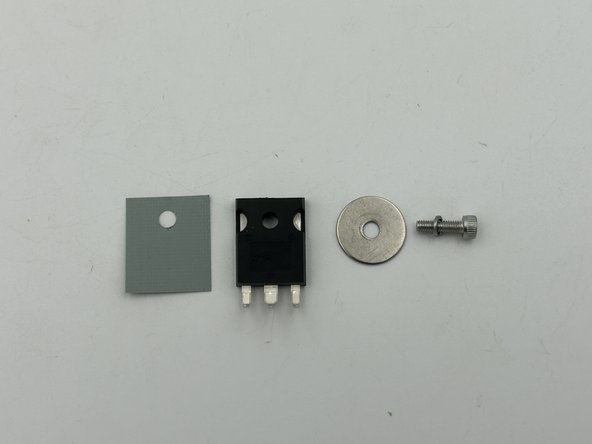 It is easiest to place all the components over the bolt and thread the bolt into the heatsink.