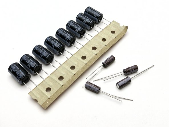 Included are (8) 1000uF capacitors. These are the larger caps, and used in positions C1 (3 per amp) and C2. (1 per amp)