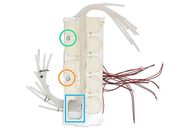 Insert the tubes on the right of each motor through the big column hole.