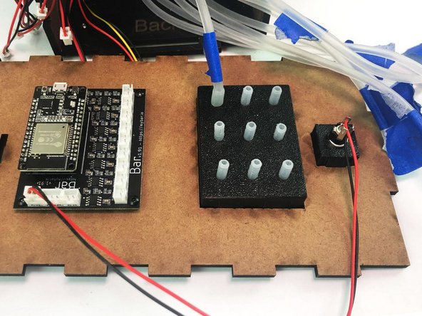 Connect the Back Silicone Tubes coming from the motors  to the matching number on the Tubes Holder (Back).
