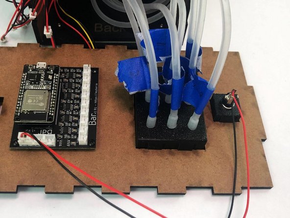 Connect the Back Silicone Tubes coming from the motors  to the matching number on the Tubes Holder (Back).