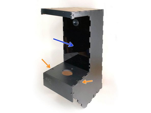 First, position the acrylic front in the case with the sensor facing out.