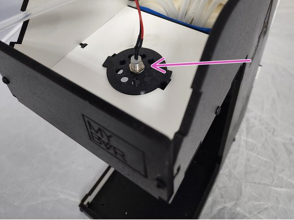 Insert the Tubes Holder (Front) into the Top front bottom panel and rotate slightly until it locks in place.