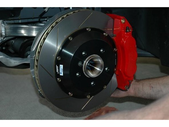 Bolt the caliper on.