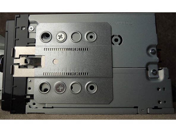Assemble the dash kit side brackets as shown in the picture below. The right angle stops should be flush with the front of the radio chassis (not the face).