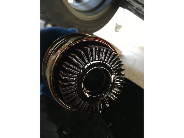 Using a Lexus/Toyota adapter , remove the oil filter housing cap