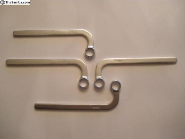 The use of 90 degree open ended wrenches will really help get access to the difficult bolts.