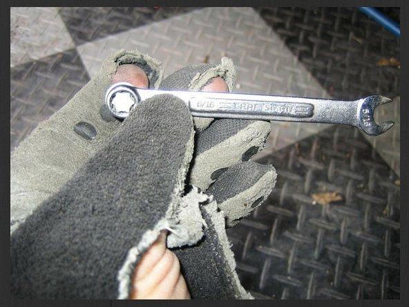 Remove heat shield - the following is for the passenger side plugs. The forward torx bolt can be removed with a 5/16&quot; combo wrench working from underneath.