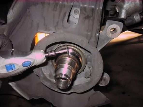 Use a dremel or long and thin two jaw puller to get off the inner race. I used a two jaw puller so it looked like this.