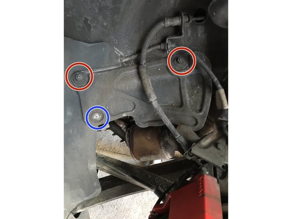 Remove the Driver and Pass side plastic shields to gain access to the exhaust flange bolts