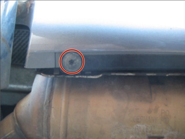From underneath, by the muffler, remove the 2 bolts holding the bottom center in place.