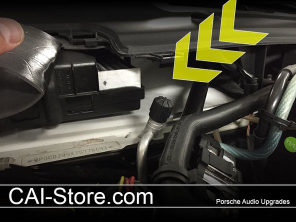 Clean the flat metal area just to the right (your right looking into the trunk) of the cabin filter. This will be the mounting location for your new antenna holder.