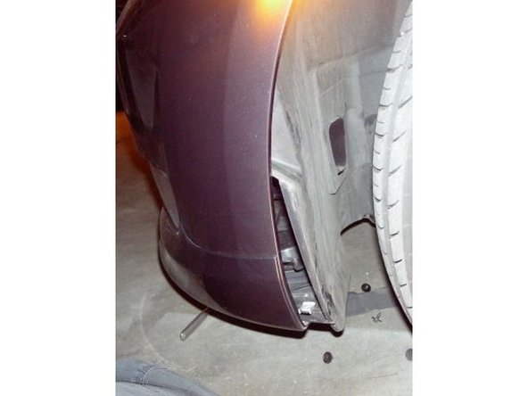 After all those screws are removed, you can pull the cover off, enough to get your hand in to replace the bulb. You can see the bulb in the second picture.