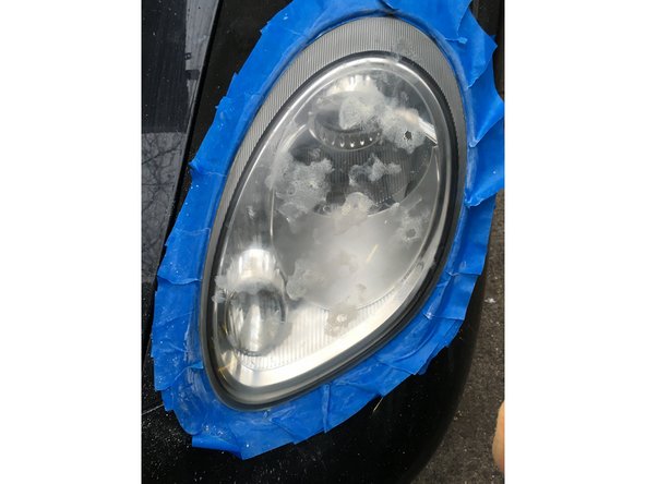 Apply a dime sized amount of compound on pad and spread around headlight to prevent splashing of the compound.