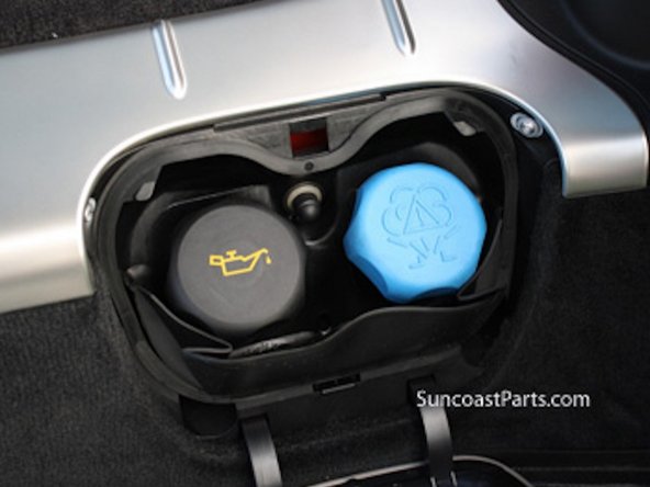 Cayman Oil Filler Cap is located on right side of trunk.