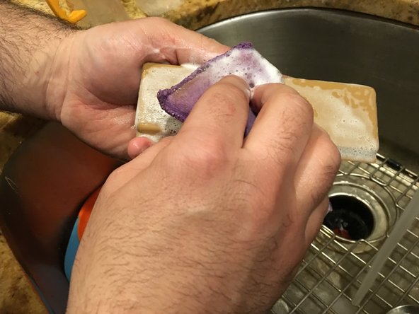 Wash the plastic piece with some dishwasher soap to remove any residue