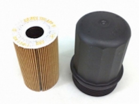 Once the oil filter cover is loose, set a plastic bag on the oil filter cover and take away the oil filter cover.