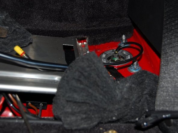 Unbolting the rear hats from the inside.