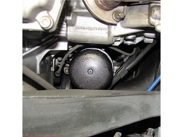 Use 14 Flute Oil Filter Cap Removal tool to loosen Plastic Filter Cap