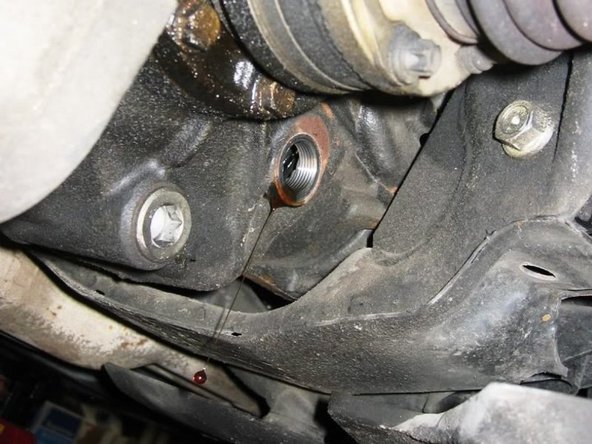 After complete drain of the old fluid, put drain bolt back on. I noticed that drain/fill bolt has green rubber o-ring  on them, but since I bought washer, I put them on and tightened to 48 ft-lb.