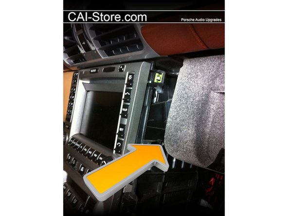 On the passenger side of the radio there is a single 7 mm screw that must be loosened before the radio will come out. The screw head is very close to the glovebox. An open ended or ratcheting combination wrench is required to remove.