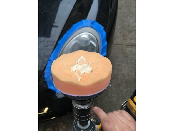 Using the soft pad and rubbing compound ,polish entire headlight.