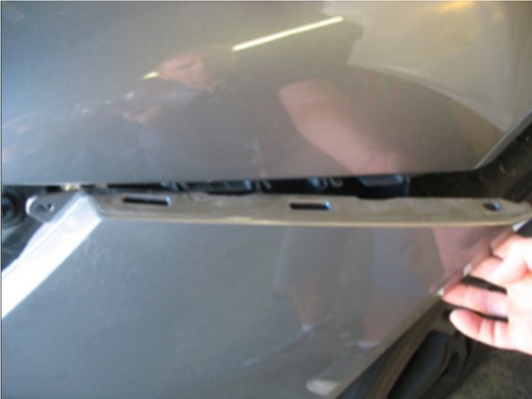 You can now pull the sides of the bumper away from the quarter panel.