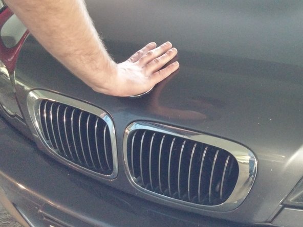 Gently close the hood.