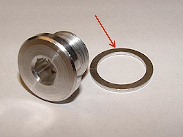 Reinstall and tighten drain plug to 37ft lb, It is crucial you use a new crush washer.