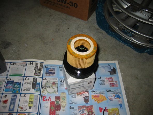 Remove the two O-rings and the filter from the filter housing, and insert the new ones. It’s a little tricky removing the O-rings, but don’t use a screwdriver since it can damage the housing. The new assembled filter housing should look like in the photo.