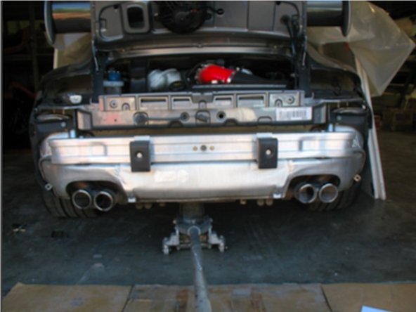 Carefully slide the rear bumper cover off of the car.