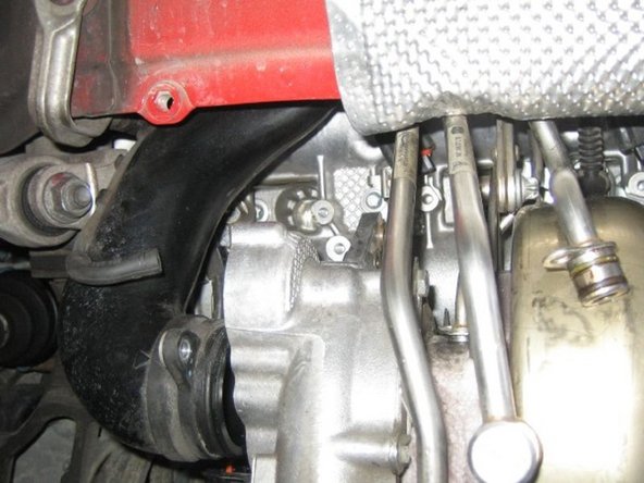 Remove the diverter valve then loosen the compressor inlet duct. Removing the diverter give you just enough room to wriggle the coil pack out and to change the plug.