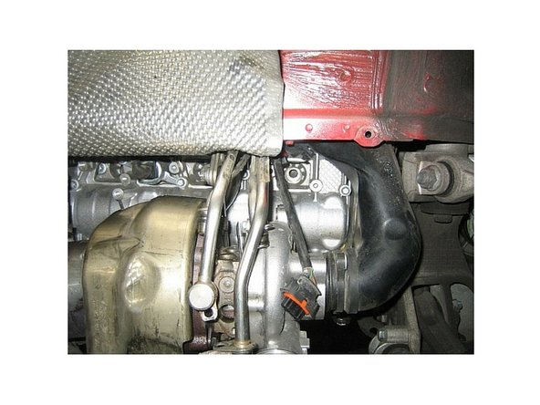 The forward plug looks impossible to get to. To R&amp;R without removing the turbo requires - unbolting and moving the 2 oil lines and 2 coolant lines to the turbo.