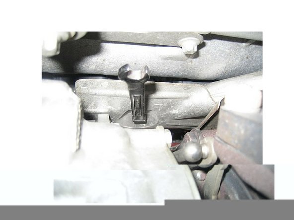 Remove heat shield - the following is for the passenger side plugs. The forward torx bolt can be removed with a 5/16&quot; combo wrench working from underneath.