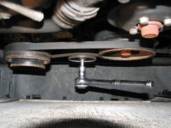 Now we need to make use of the T50 Torx bit. To detension the tensioner you turn it clockwise with the ratchet. If you have it as shown in this picture, you push down on the ratchet.
