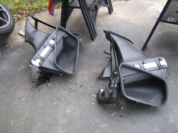 Jack up rear of car and remove wheels. Remove rear wheel liners.