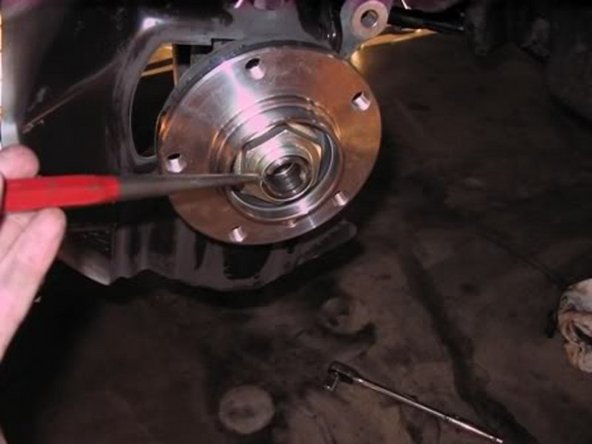 Now using a punch or like dent in the outer portion of the hub nut as a safety precaution.