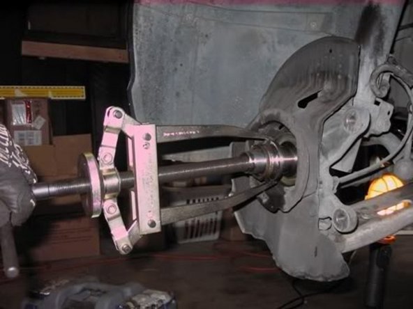 Use a dremel or long and thin two jaw puller to get off the inner race. I used a two jaw puller so it looked like this.