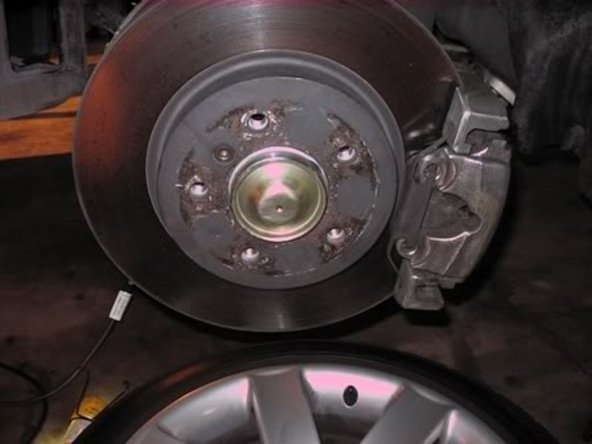 Clean the hub cover and apply light coat of anti seize on the lip and then gently tap it on with a deadblow.