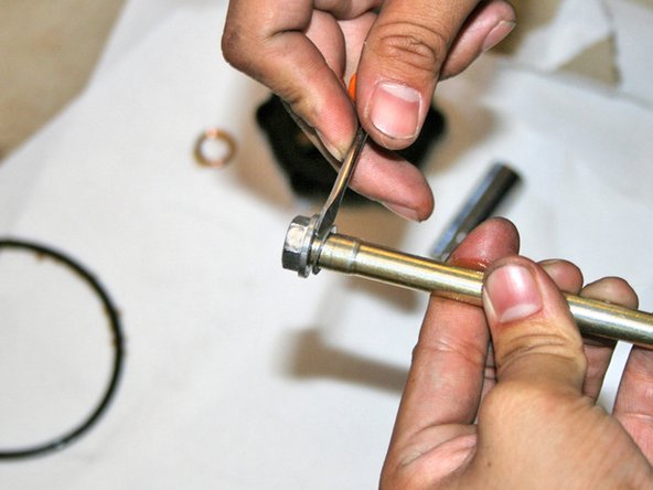 Change the washer at the top of the oil filter housing bolt.