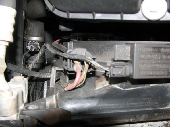 Once those are out you need to remove the two electrical connectors on the left side of the shroud. The smaller connector might be a little tough to remove, you push the tab on the top down and carefully wiggle it off. The big connector should be pretty easy to get off.