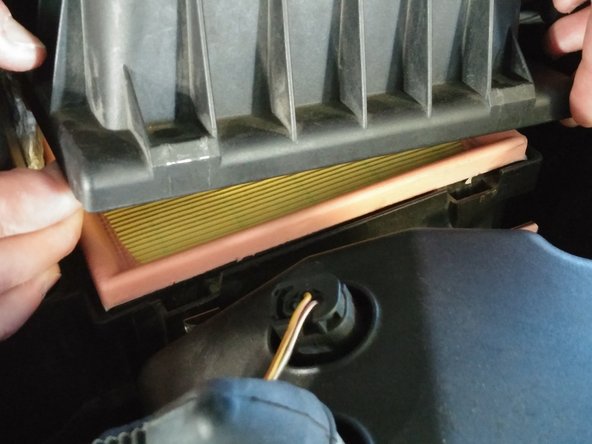 Gently lift the air box lid up on the right side enough to remove the air filter (should be about 3-4 inches).